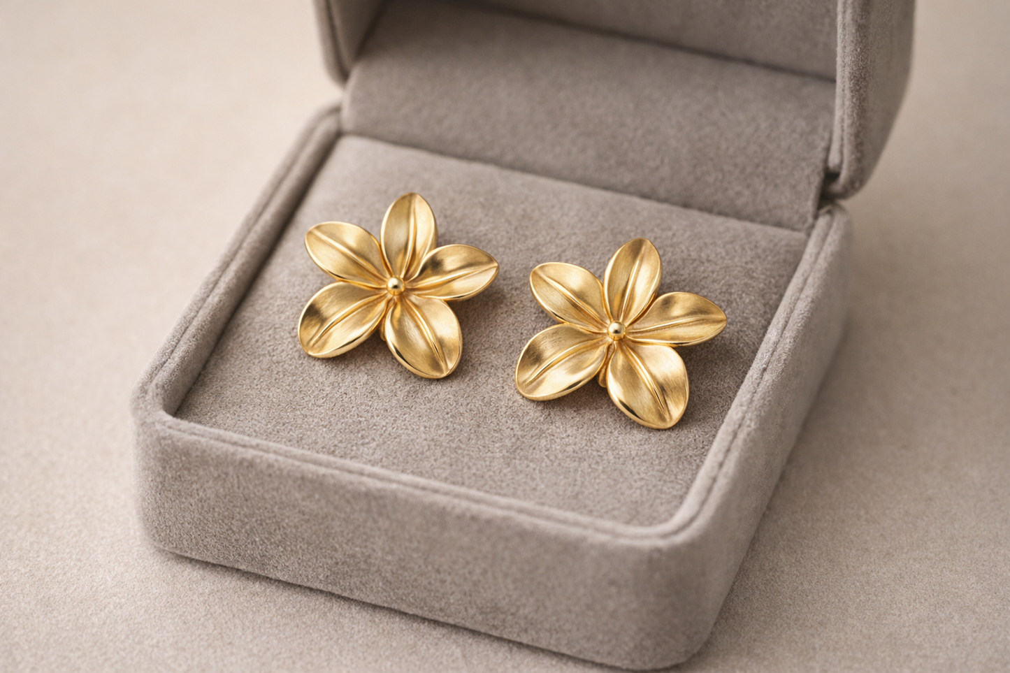 Gold floral stud earrings